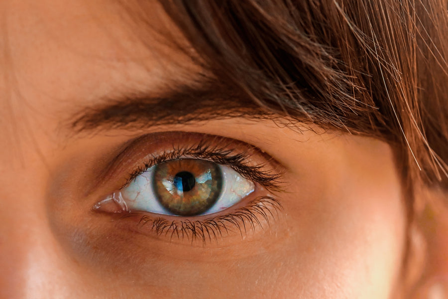 Close-up of an eye wearing a contact lens.