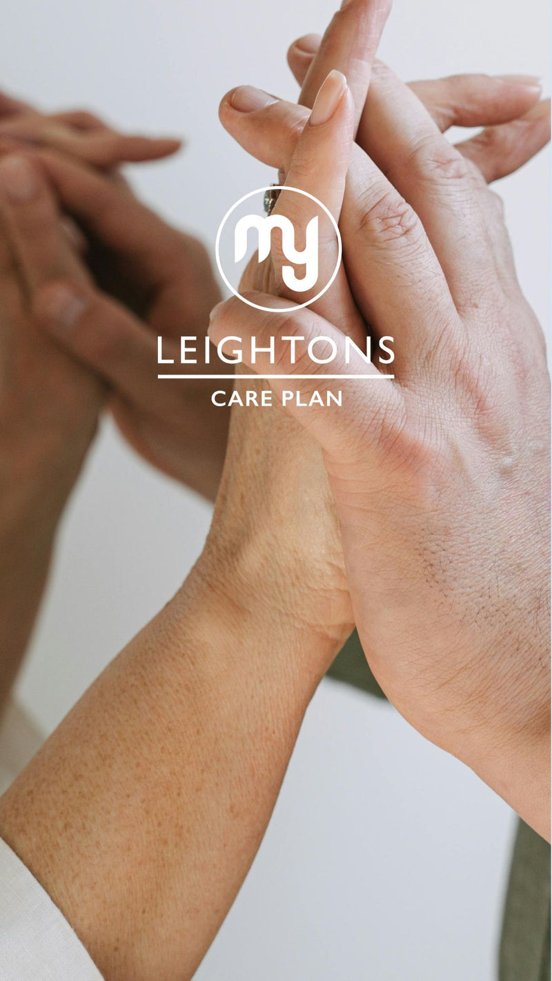 Two stylish models pose confidently in eyeglasses with a foggy backdrop.