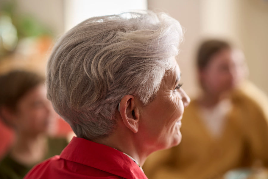 A vibrant purple ribbon icon with a geometric design.