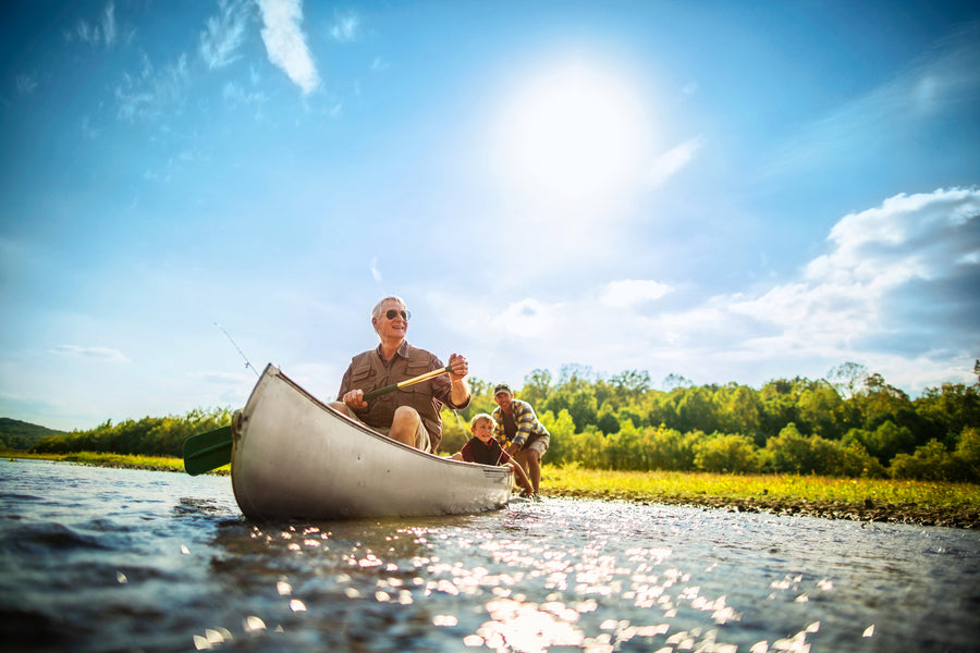 A senior man with a beard wearing a striped sweater, looking thoughtfully.
