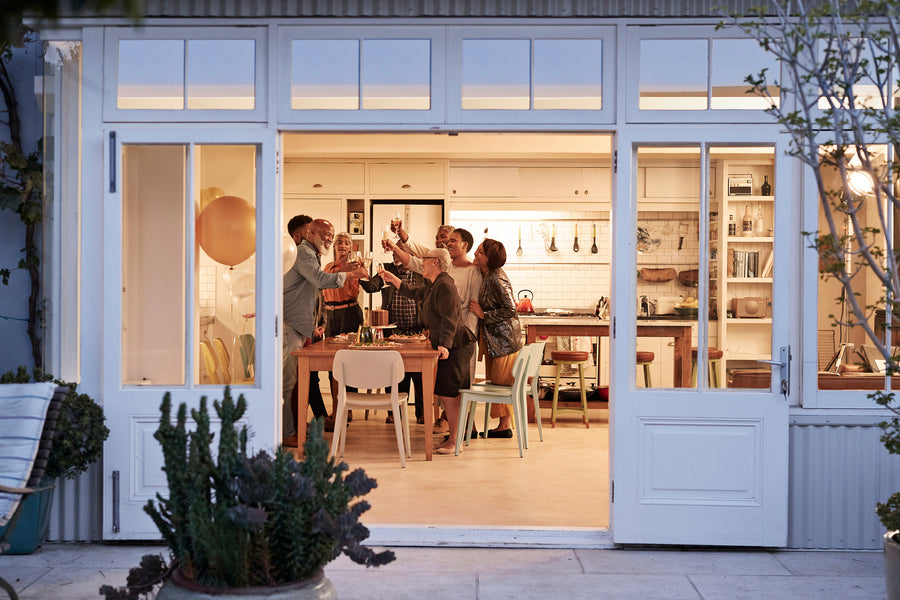 A woman with blonde hair smiling while seated in an office.