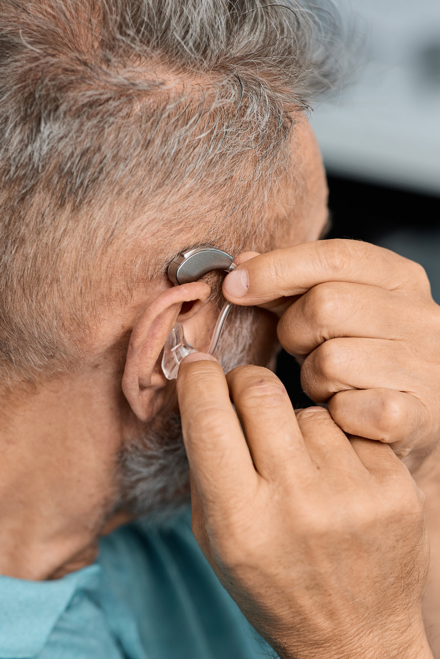 A woman relaxes in an airplane seat, listening to music.