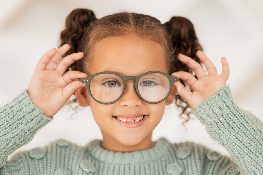 girl wearing new green glasses