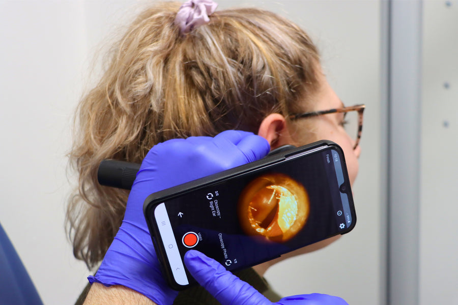 A purple award ribbon with a rosette and tails design.