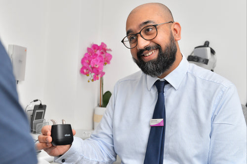 Close-up of a man undergoing an eye examination with equipment.