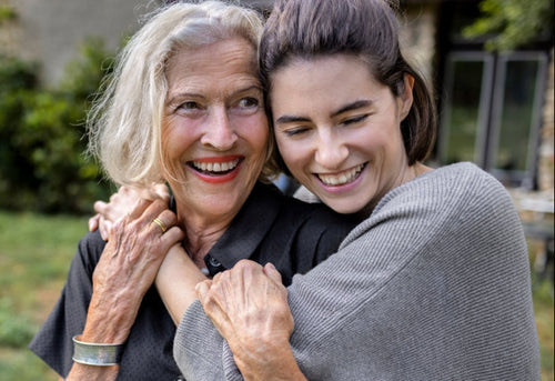 A pair of stylish sunglasses resting on a textured gray surface.