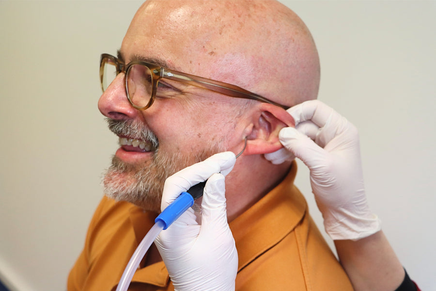 An illustration of a teacher presenting to an audience.