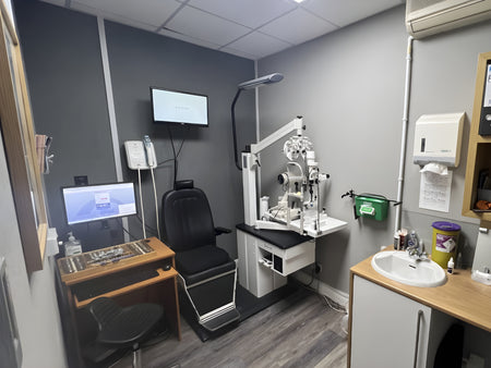 Ophthalmology examination room with medical equipment.