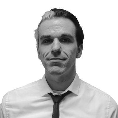 A woman with protective goggles receiving a skin treatment.