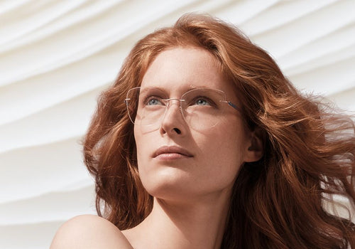 A cheerful man and woman express excitement, promoting word of mouth.