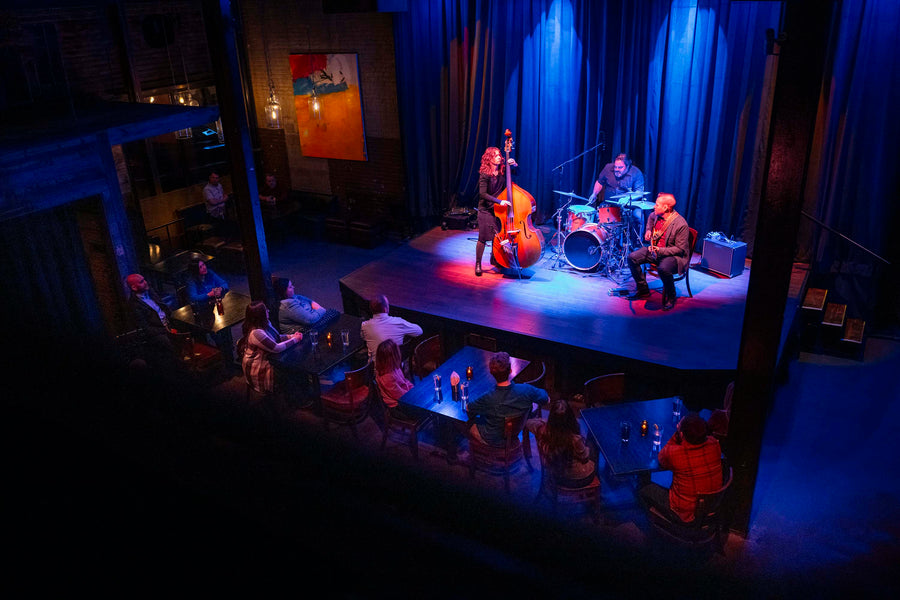 A woman is having a hearing aid fitted to her ear.